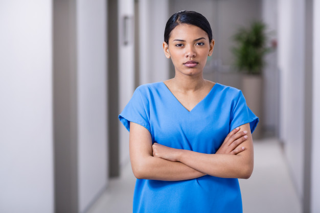 portrait-nurse-standing-with-arms-crossed_107420-75241